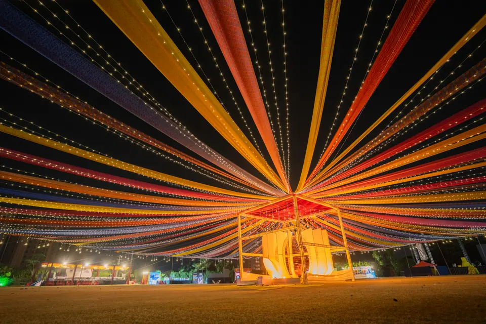Ribbons of coloured light fanning out over the ground at night